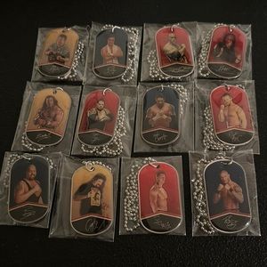 12 WW Wrestling Dog Tags Necklaces. All 12 are new.